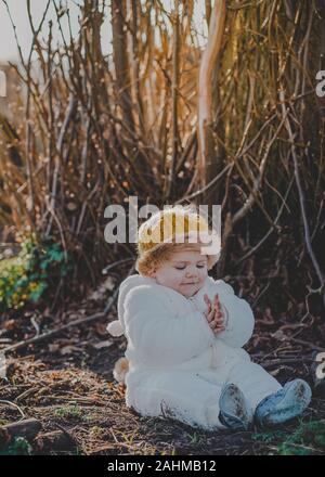 Little boy dressed as Max from Where The Wild Things Are in the woods