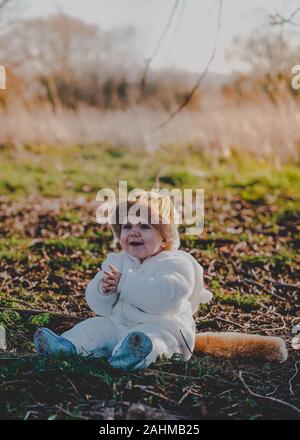 Little boy dressed as Max from Where The Wild Things Are in the woods