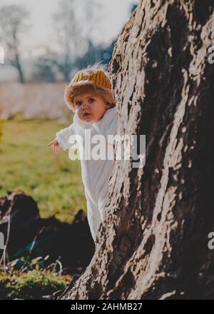 Little boy dressed as Max from Where The Wild Things Are in the woods