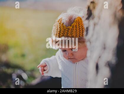 Little boy dressed as Max from Where The Wild Things Are in the woods