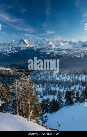 Bernese Alps with Eiger, Mönch and Jungfrau with Lake Thun Stock Photo