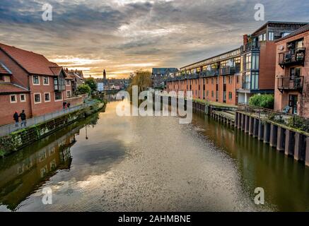 A view down the River Wensum from White Friars Bridge in the city of Norwich at dusk Stock Photo