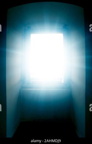 window with divine rays of light coming through Stock Photo