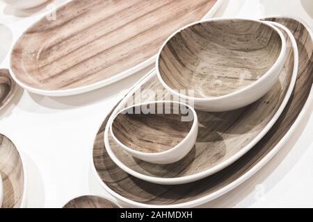 multi-colored dishes utensils on a white background Stock Photo