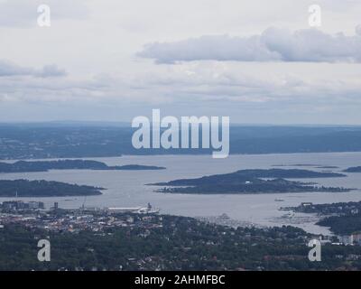Landscapes of fjord near european town of Oslo in Holmenkollen district in Norway with cloudy sky in 2019 cold summer day on July. Stock Photo