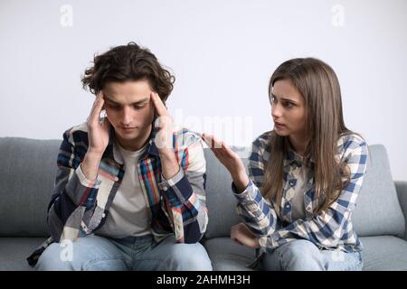 Young couple in checkered shirts have relationship problems. Stock Photo