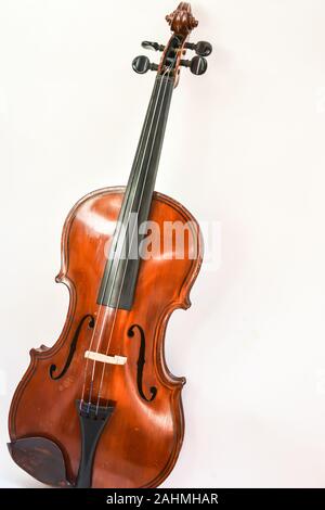 Old German violin. A stringed musical instrument originally from Saxony of the early 19th century. Stock Photo