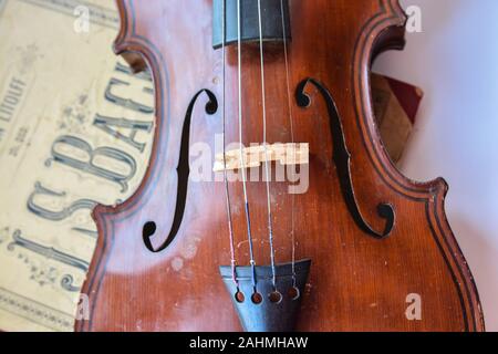 Old German violin. A stringed musical instrument originally from Saxony of the early 19th century. Stock Photo