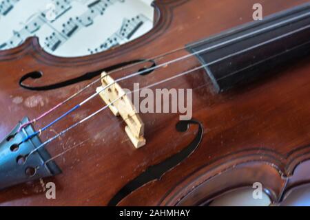 Old German violin. A stringed musical instrument originally from Saxony of the early 19th century. Stock Photo