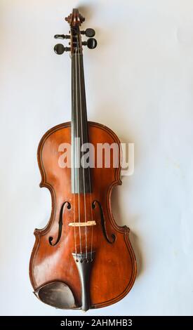 Old German violin. A stringed musical instrument originally from Saxony of the early 19th century. Stock Photo