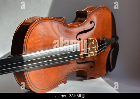 Old German violin. A stringed musical instrument originally from Saxony of the early 19th century. Stock Photo