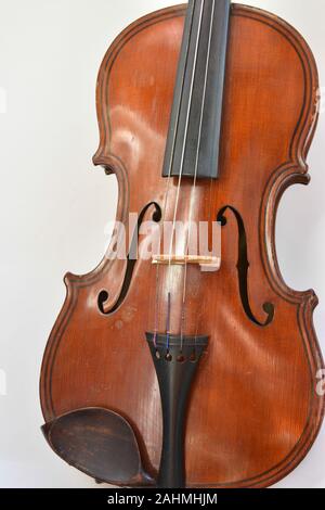 Old German violin. A stringed musical instrument originally from Saxony of the early 19th century. Stock Photo