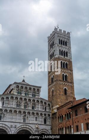 Lucca Cathedral (Duomo di Lucca, Cattedrale di San Martino) is a Roman Catholic cathedral dedicated to Saint Martin of Tours. It is the seat of the Ar Stock Photo