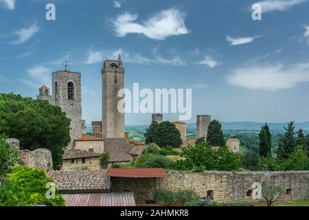 San Gimignano is a small walled medieval hill town. It is famous for its medieval architecture, unique in the preservation of about a dozen of its tow Stock Photo