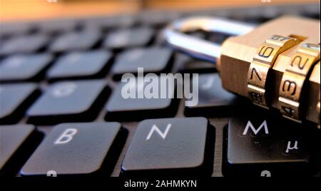Lock for security placed on PC keyboard Stock Photo