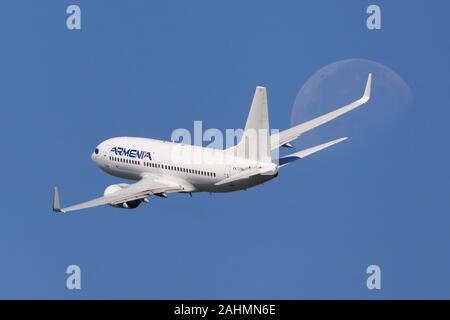 Barcelona, Spain - August 21, 2019: Aircompany Armenia Boeing 737-700 banking left after taking off from El Prat Airport in Barcelona, Spain. Stock Photo