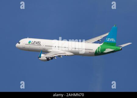 Barcelona, Spain - August 23, 2019: Level Airbus A321-200 banking left after taking off from El Prat Airport in Barcelona, Spain. Stock Photo