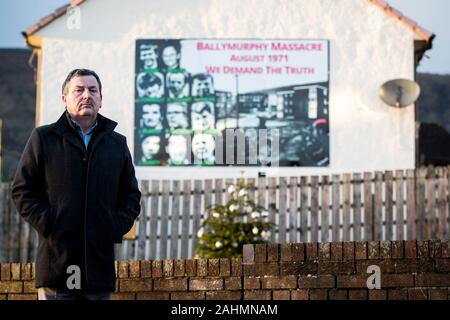 John Teggart, standing in the Ballymurphy area of west Belfast, where his father Daniel Teggart, was among those killed in the series of shootings between August 9-11, 1971. 22/12/19 Stock Photo