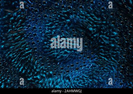 abstraction in the form of bubbles and ripples of water of dark blue color Stock Photo