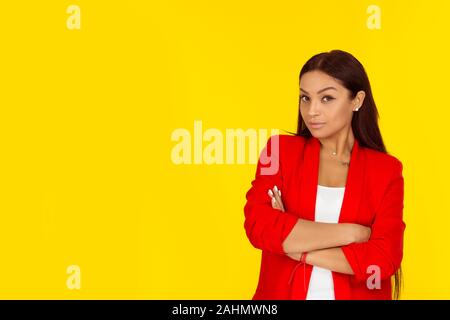 Portrait closeup funny skeptical woman thinking looking at camera inquiring face expression, emotion, body language. Mixed race model isolated on yell Stock Photo