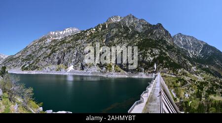 Panorama of the Dam and Estany de Cavallers Lake at left, Boi valley at right and mountains in Alta Ribagorca of Catalan Pyrenees, Aiguestortes Nation Stock Photo