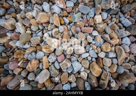 Stack of stones against blurred seascape on a beach swansea wales, space for text. Zen concept Stock Photo