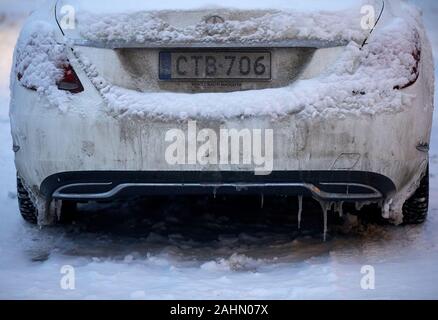 Finnish Rovaniemi a city in Finland and the region of Lapland, Mercedes-Benz C-Class back dirty and frozen snow-covered dirty registration late Stock Photo