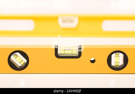 Close up of a spirit level, used to ensure a surface is horizontal or vertical but also as a straight edge or known flat. Stock Photo