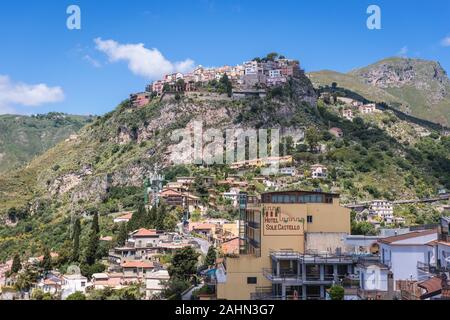 Castelmola town seen from Taormina comune in Metropolitan City of Messina, on the east coast of the island of Sicily, Italy Stock Photo