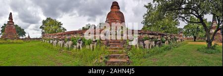 Panoramic View of Principal Chedi in Wat Maheyong Buddhist temple in Ayutthaya, Thailand, The chedi's platform is supported by sculpted elephants, Stock Photo