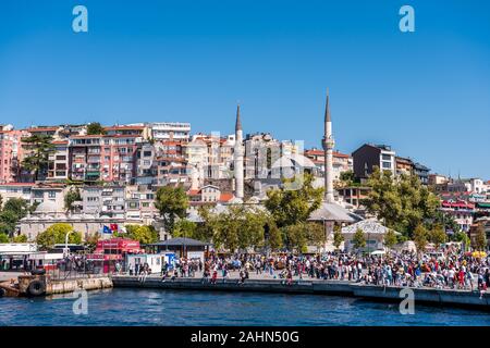 A lot of people at the square near the Uskudar port on holiday, with background of Mihrimah Sultan Camii, built by architect Mimar Sinan under the ord Stock Photo
