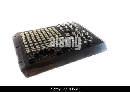 Studio Controller Desk for Electronic Music Production and Music Track Mixing. Shot on white background. Stock Photo