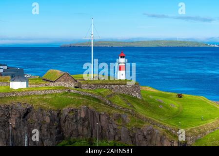 Skansin fortress of Torshavn and its lighthouse in Faroese island of Streymoy. Atlantic Ocean and Nolsoy island are at background Stock Photo