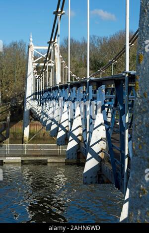 the grade II listed teddington bridge, or teddington lock footbridge, spanning the river thames between teddington and ham, southwest london, england Stock Photo