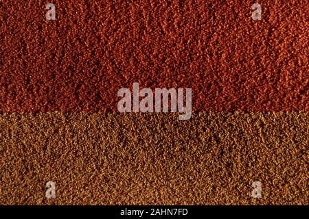 Distressed overlay texture of cracked concrete, stone or asphalt. Grunge colorful background.  Small grains of sand as a wallpaper. Stock Photo