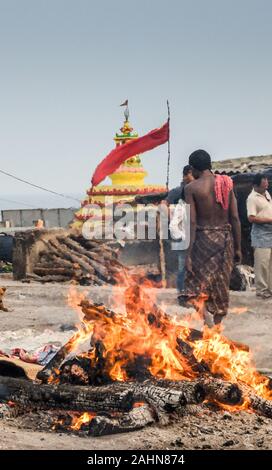 PURI,ODISHA/INDIA-MARCH 12 2018:The body of a Hindu person is cremated at Swargadwar crematorium next to the main beach.A steady flow of corpses are b Stock Photo