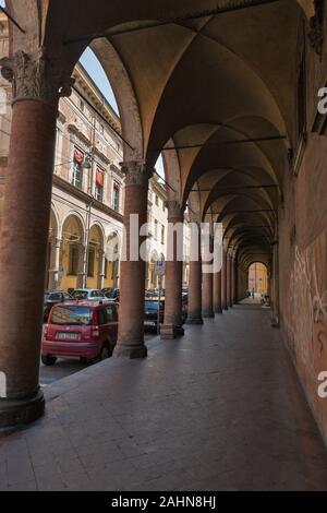 BOLOGNA, ITALY - JULY 10, 2019: Felicini Palace colonnade in city historic centre. Bologna is the capital and largest city in Northern Italy. Stock Photo