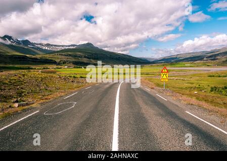 Ring road 1 in Eastern Iceland before crossing Hamarsa stream. Bragdavellir farm area is at left background. Stock Photo