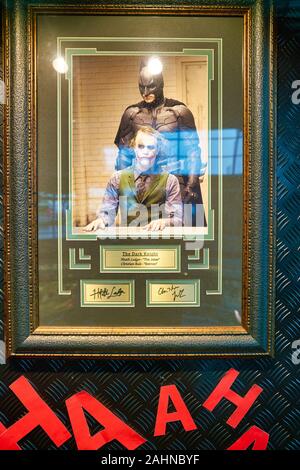 SINGAPORE - CIRCA APRIL, 2019: Heath Ledger and Christian Bale signs on display at DC Comics Super Heroes Cafe in Singapore. Stock Photo