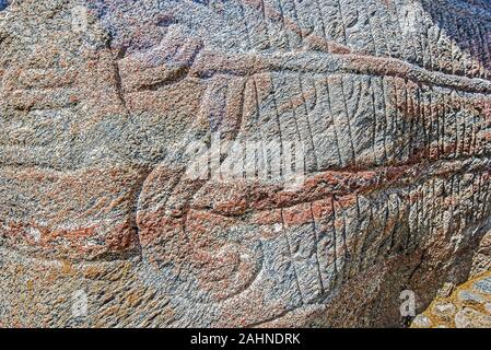 Runic inscriptions on the Harald’s runestone in Viking historical site of Jelling village of Denmark. The monument made in memory of the King Gorms an Stock Photo