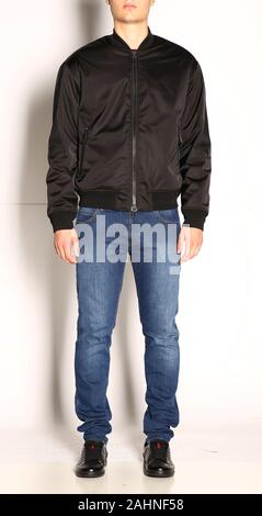 Fashionable blank dress wearing young men and standing on white background with shadows.front view Stock Photo