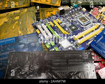 Wien/Austria - june 4 2019: pile of discarded computer mother boards  sorted on a bin  in a recycling and recovery compound in vienna Stock Photo