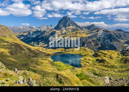 View at Ossau valley from the mountain pass Ayous in Franch Atlantic Pyrenees, as seen in October. Lake Gentau is at foreground of the famous Pyrenean Stock Photo