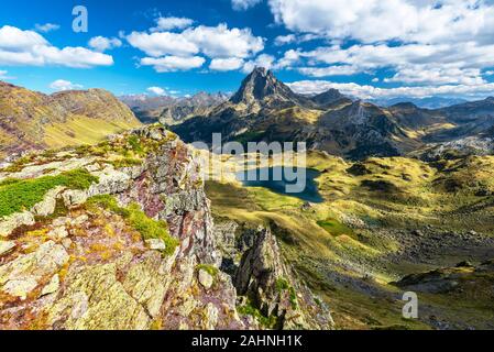 Lake Gentau and the famous Pyrenean peak Midi Ossau as seen from the mountain pass Ayous in Octber. Atlantic Pyrenees, Bearn, France. Stock Photo