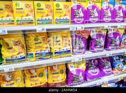 Samara, Russia - December 21, 2019: Various fresh cat food ready for sale on supermarket shelves. Cat food as background Stock Photo