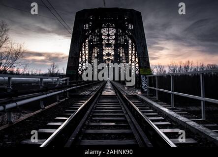 Disappearing train in the mist Stock Photo