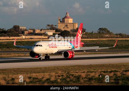 Air Malta Airbus A320neo (A320-200N) jet plane on the runway after landing at Malta International Airport. Modern air travel in Europe. Stock Photo