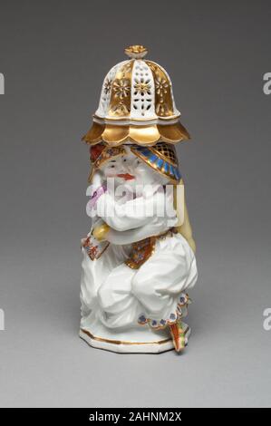 Meissen Porcelain Manufactory (Manufacturer). Sugar Caster with Cover (one of a pair). 1732–1742. Meissen. Hard-paste porcelain, polychrome enamels, and gilding By the 17th century, many European nations were trading heavily in the Orient, importing such products as tea, chocolate, furniture, silk, and porcelain. The discovery in the 18th century of the secret method the Chinese used to make porcelain was one of the most important achievements of the royal Meissen porcelain factory near Dresden. The tureen from this centerpiece and stand with a pair of sugar casters, designed by Meissen’s chie Stock Photo
