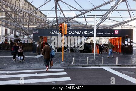 NAPLES, ITALY - NOVEMBER 20, 2019: People at the entrance to the Garibaldi Metro Station designed by French architect Dominique Perraulto  in Piazza G Stock Photo