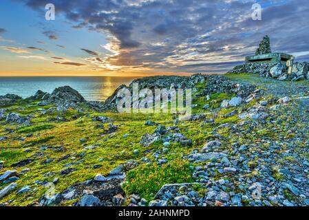 Sunrise as viewed at Hamningberg fort in Varanger Peninsula of Norwegian Finnmark. Stock Photo